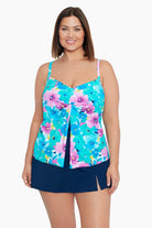 Woman wearing a multicolored floral print middle split tankini top