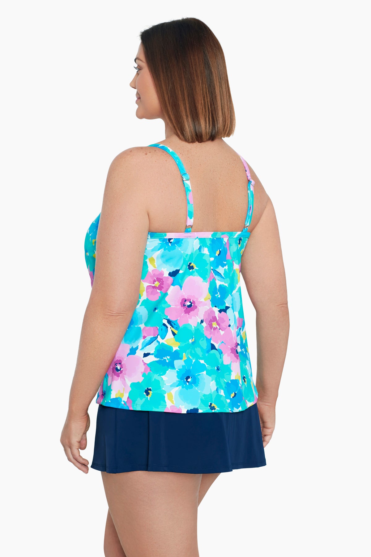 Woman turned left wearing a multicolored floral print middle split tankini top