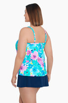 Woman turned left wearing a multicolored floral print middle split tankini top