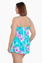 Woman turned left wearing a multicolored floral print one-piece swimsuit