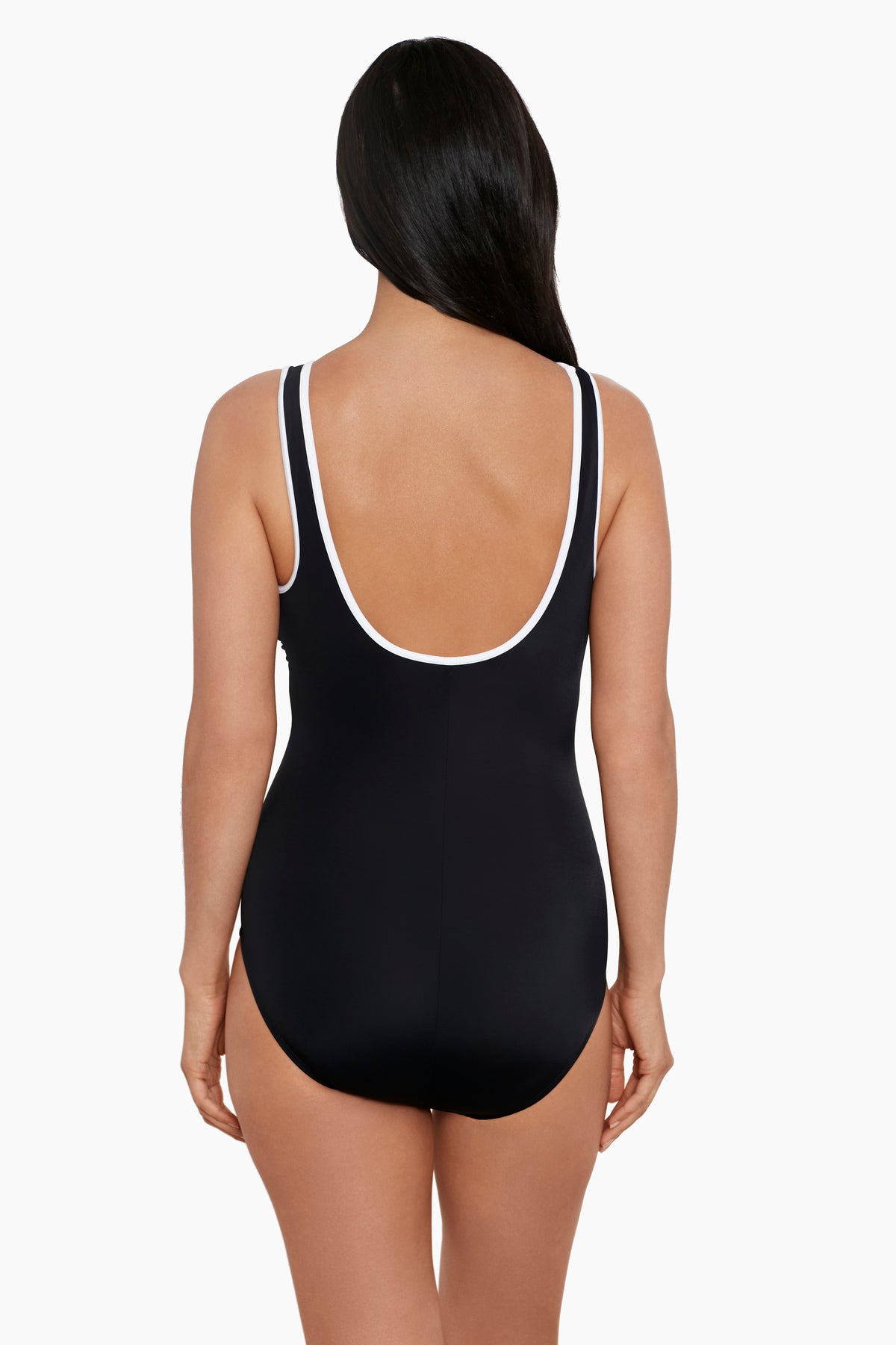 Woman faced away wearing a black one-piece swimsuit with white piping on the straps