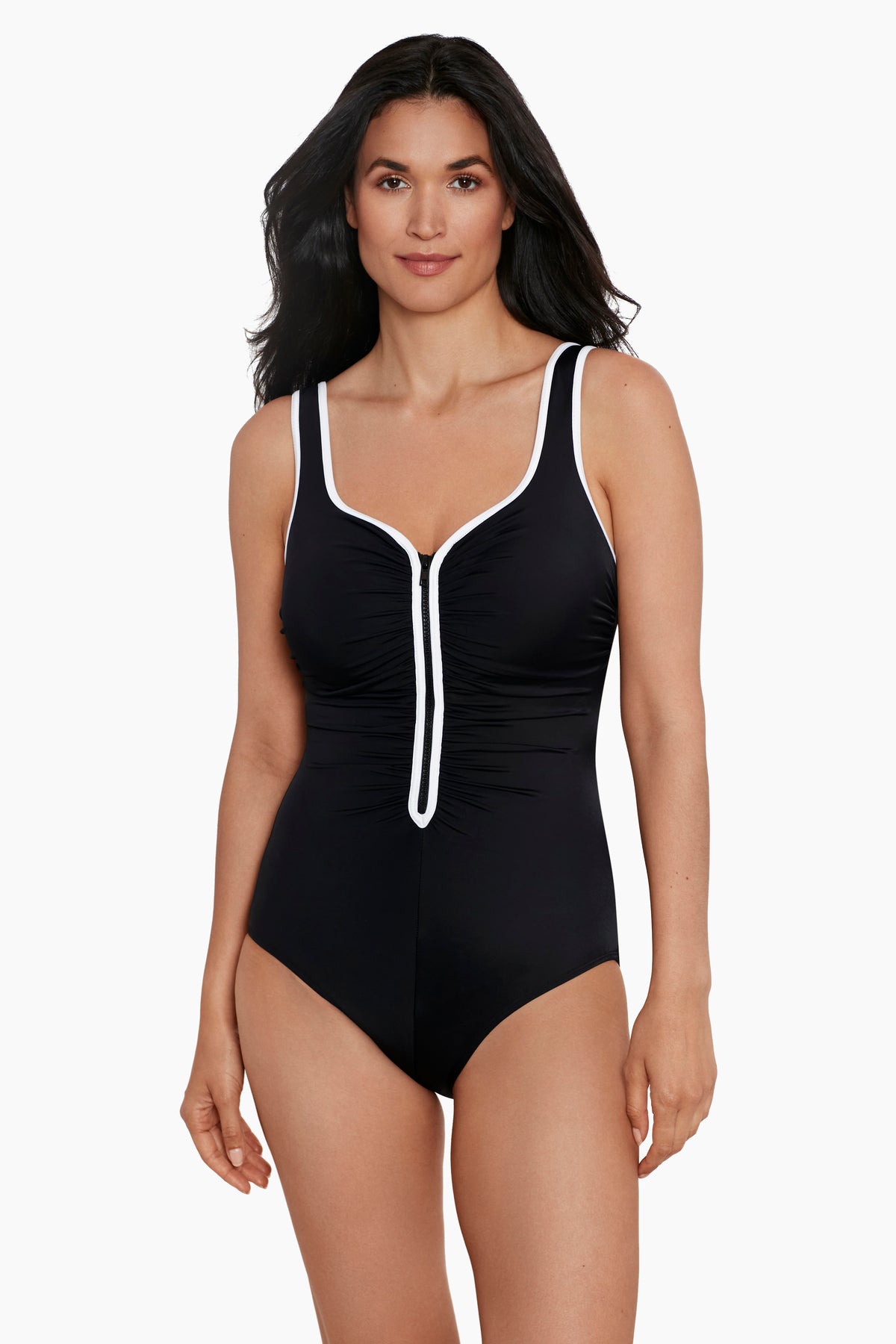Woman wearing a black one-piece swimsuit with white piping down the front and on the straps