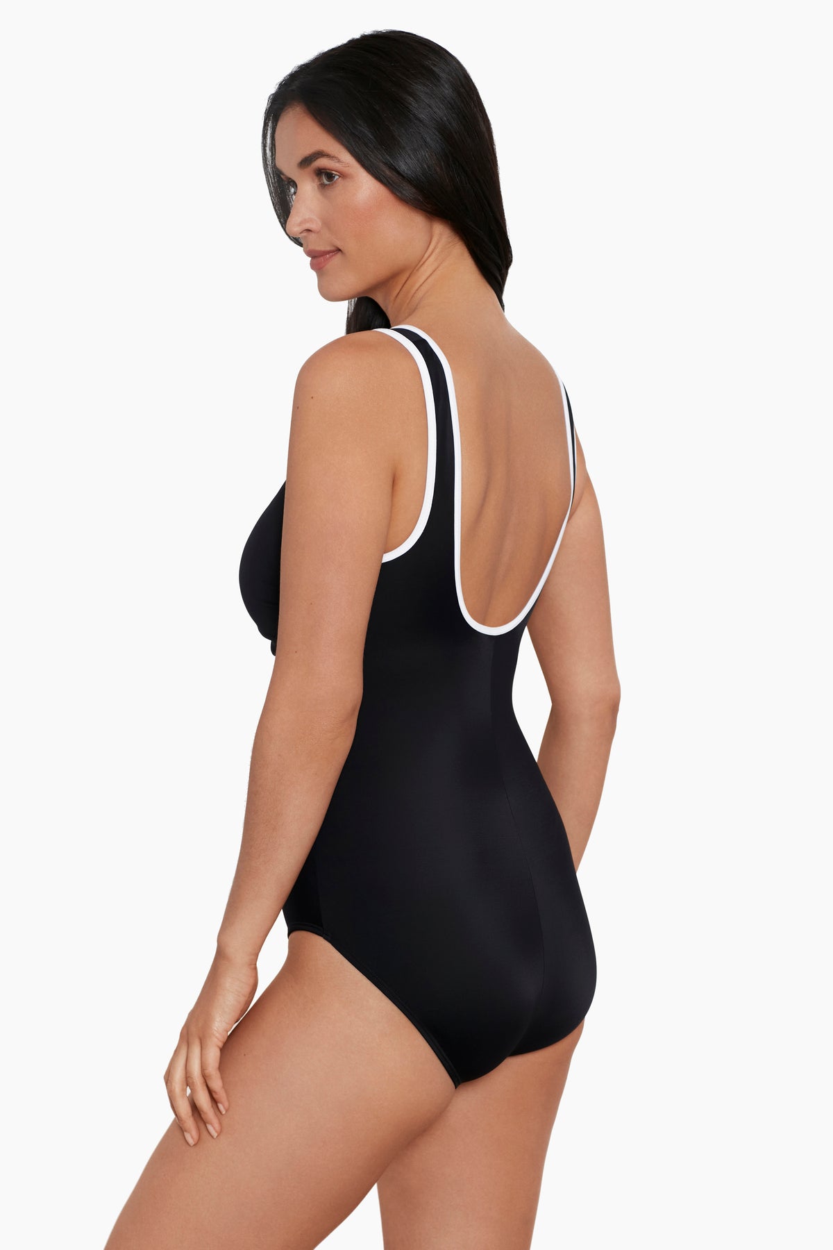 Woman turned left wearing a black one-piece swimsuit with white piping on the straps